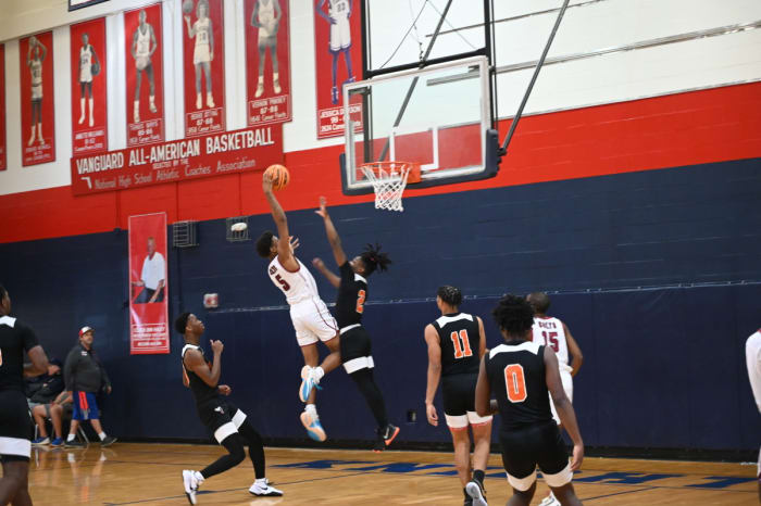 North Marion junior guard Brenden Barber goes in for the slam dunk in a Challenge Round game against Hawthorne on Saturday at the Kingdom in the Sun Tournament at Vanguard High School in Ocala.